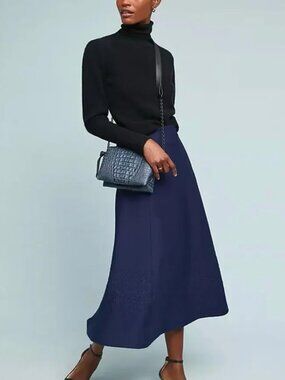 Maeve / Anthropologie heavy knit navy A-line skirt with embroidery detail.